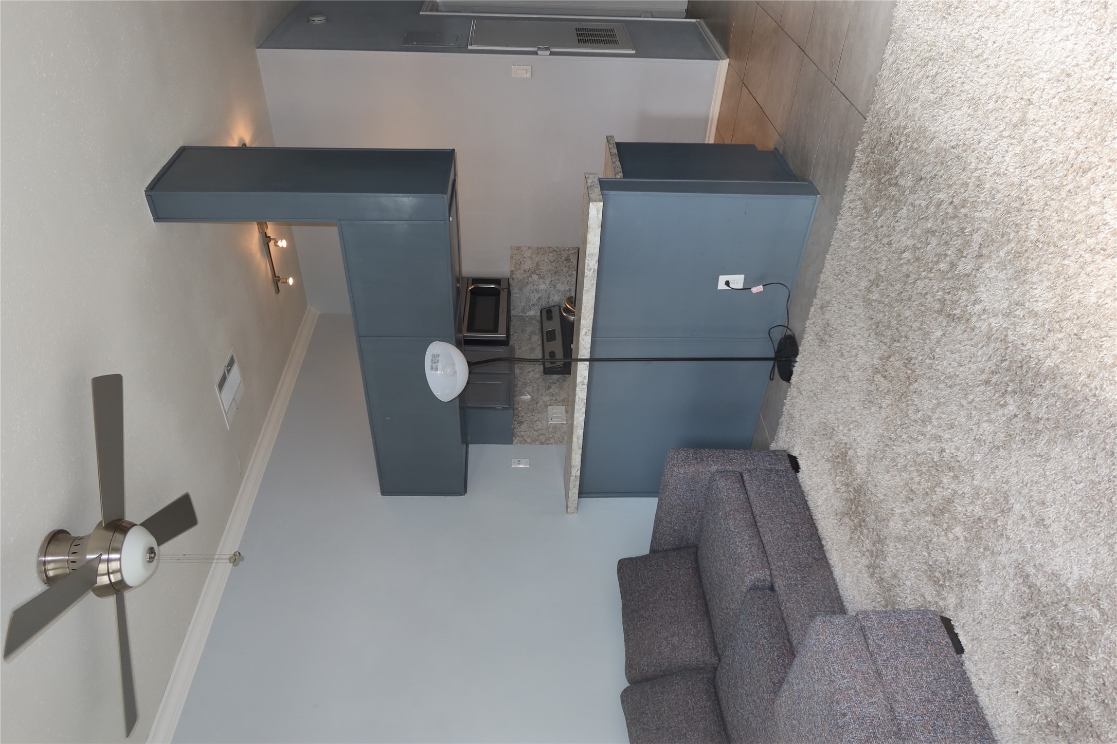 2802 Nueces Street, Unit 306 Austin, TX 78705 - Photo 3 of 17 a living room with a couch