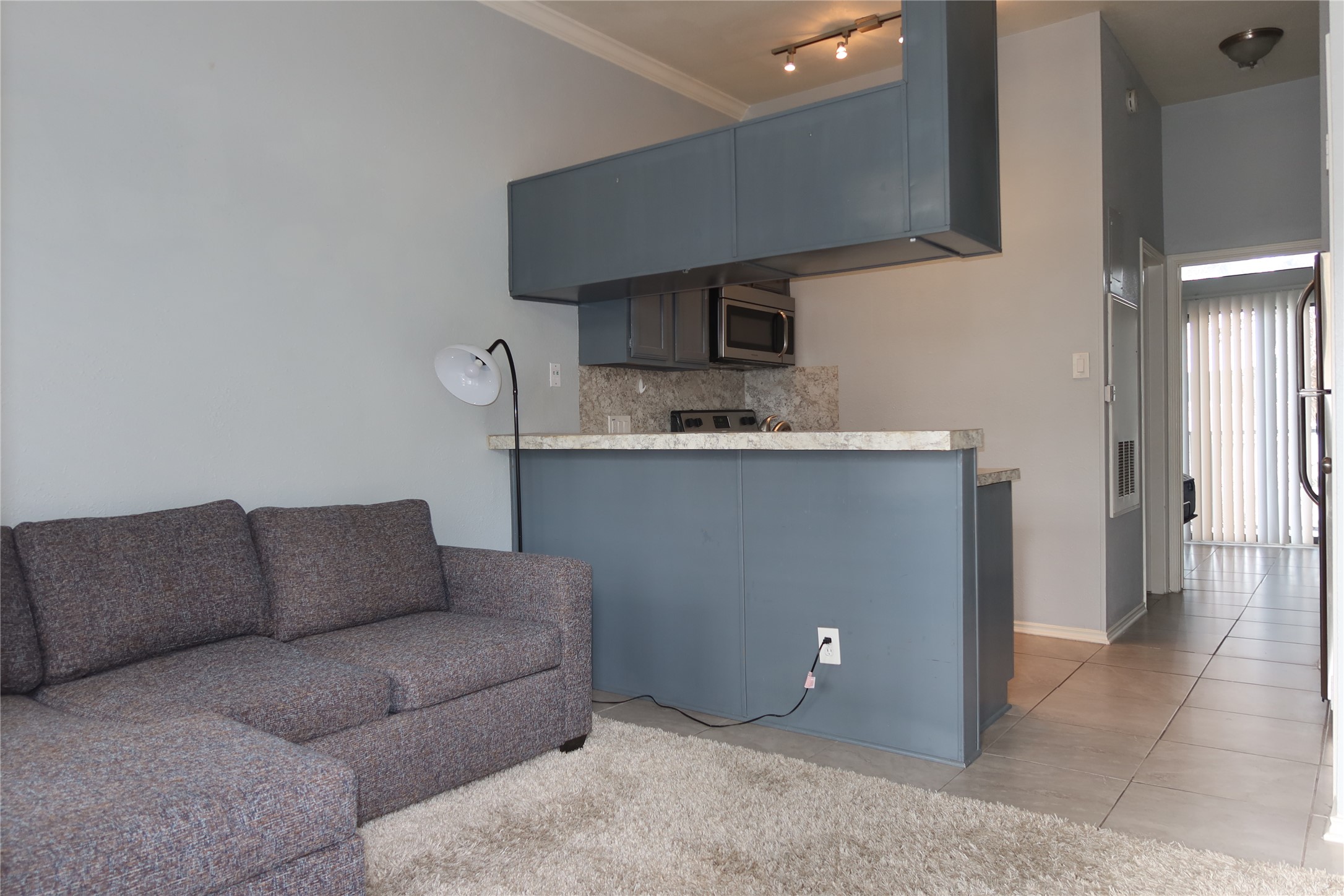 2802 Nueces Street, Unit 306 Austin, TX 78705 - Photo 4 of 17 a living room with furniture and a couch