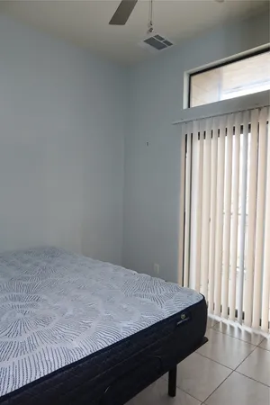 a room with a bed and a window