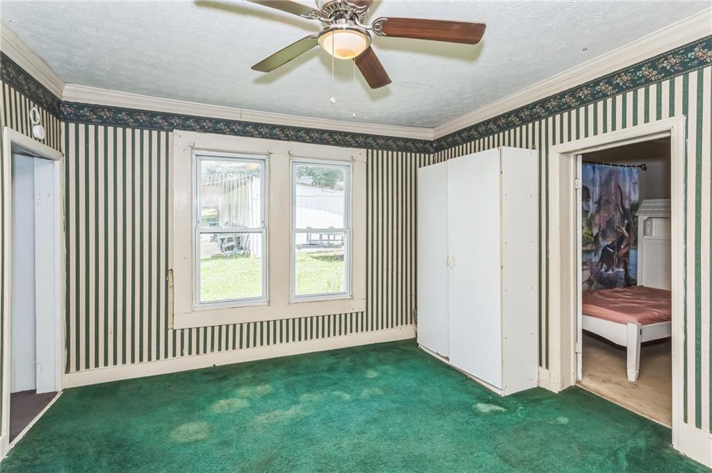 2523 Highway 411 Ranger, GA 30734 - Photo 6 of 9 a view of an empty room with window and a ceiling fan
