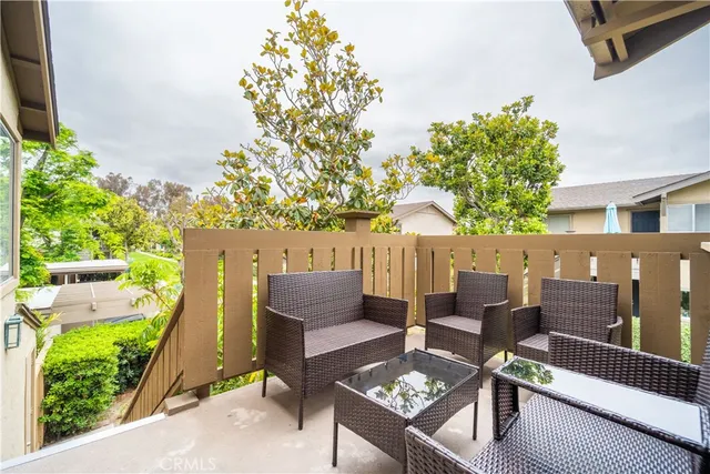 swimming pool view with a seating space