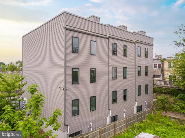 a kitchen with stainless steel appliances a stove a sink and a refrigerator