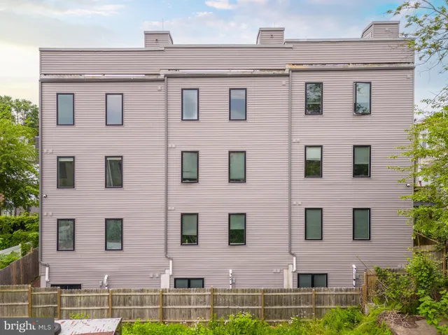 a kitchen with stainless steel appliances a stove a refrigerator and a sink