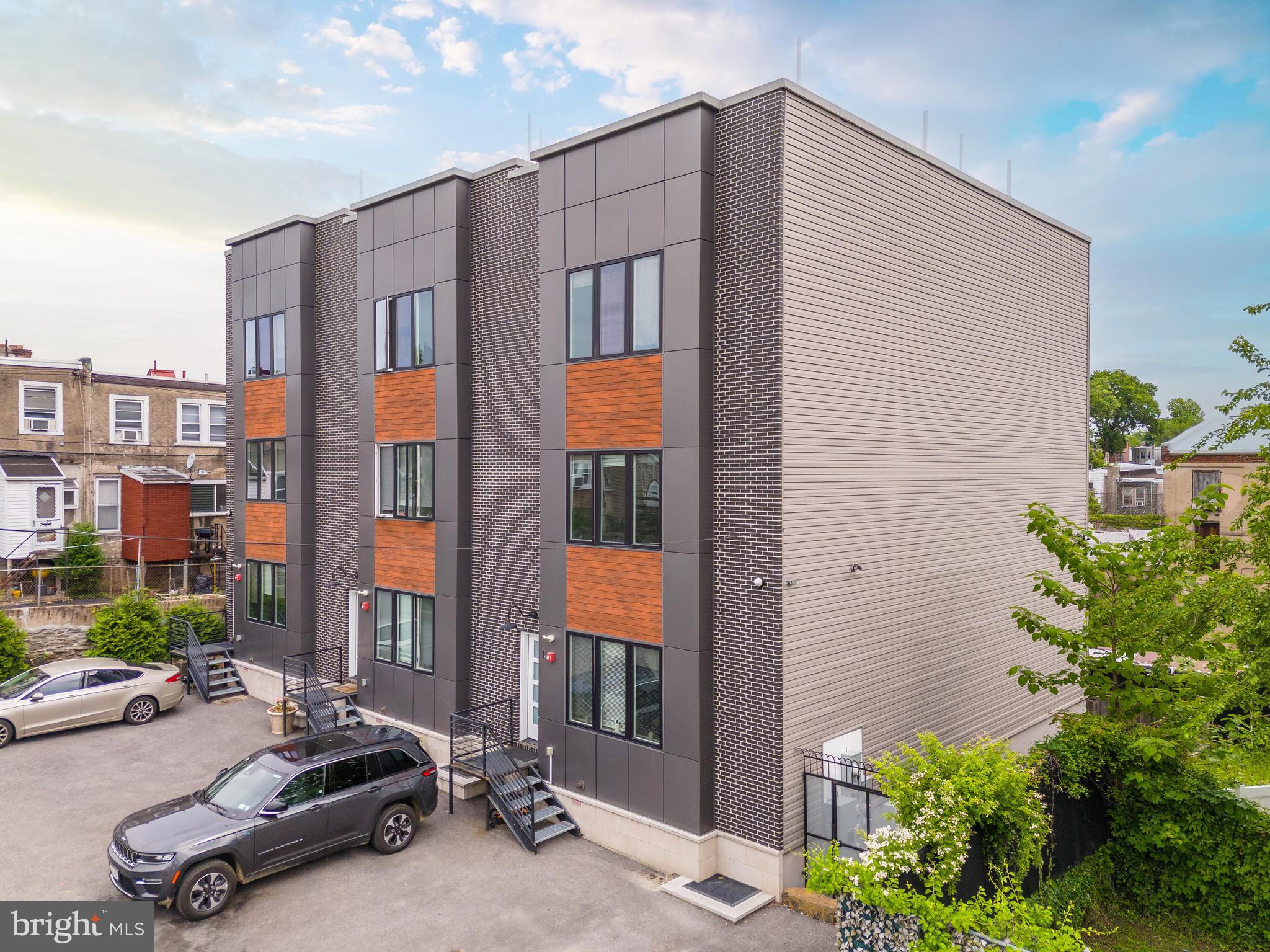 85 East Sharpnack Street Philadelphia, PA 19119 - Photo 4 of 47 a car parked in front of a house
