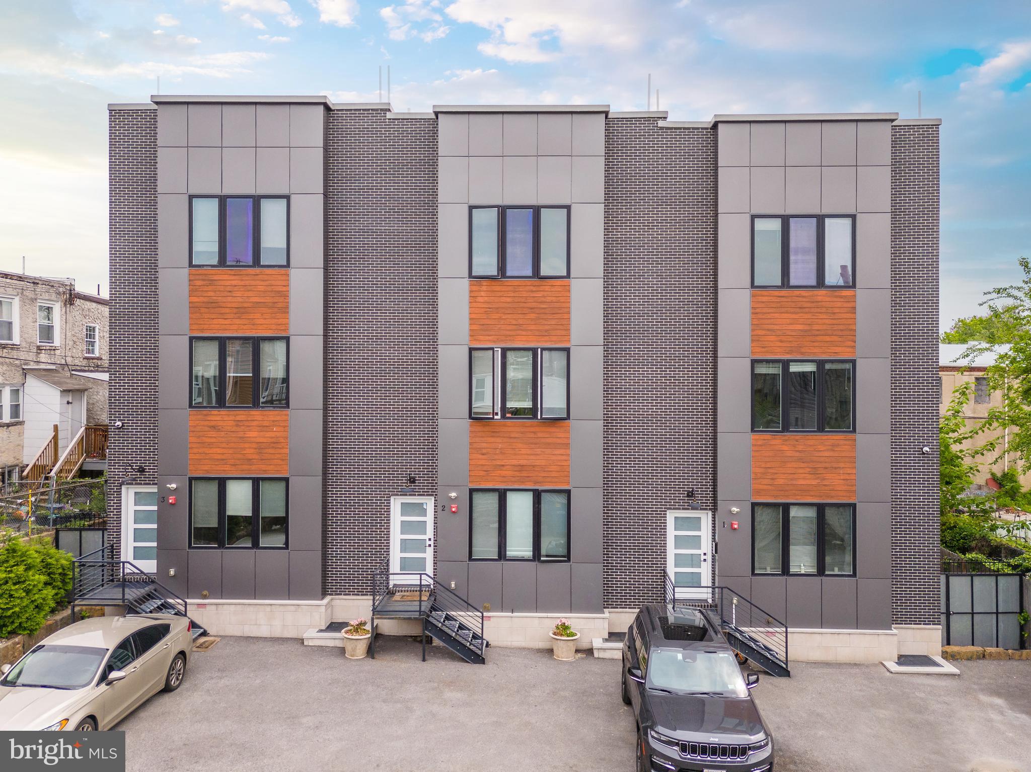 85 East Sharpnack Street Philadelphia, PA 19119 - Photo 5 of 47 a front view of a building with a outdoor space