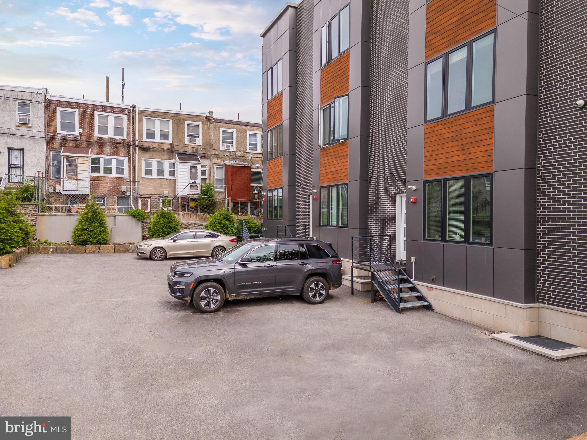 85 East Sharpnack Street Philadelphia, PA 19119 - Photo 8 of 47 a car parked in front of a brick building