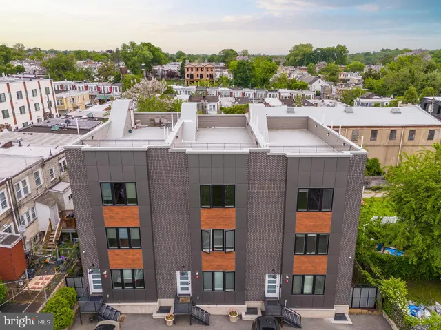 a couple of cars parked in front of buildings