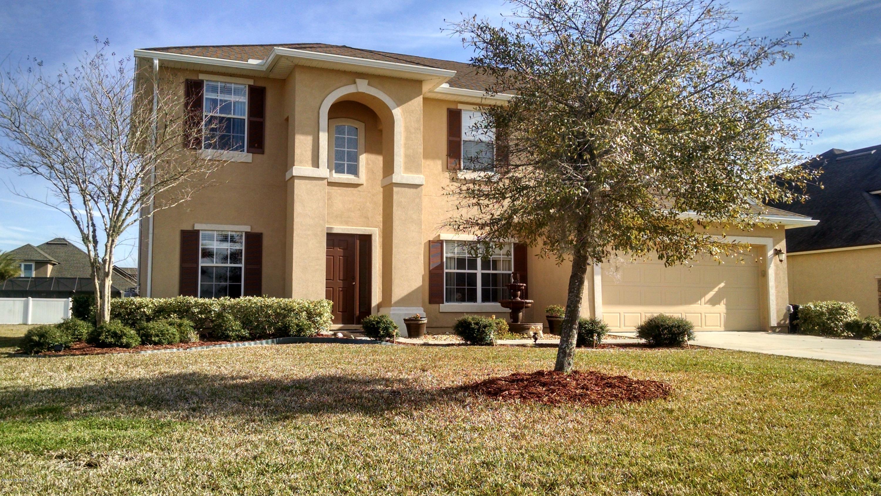 229 Porta Rosa Circle St. Augustine, FL 32092 - Photo 1 of 41 a front view of a house with a yard