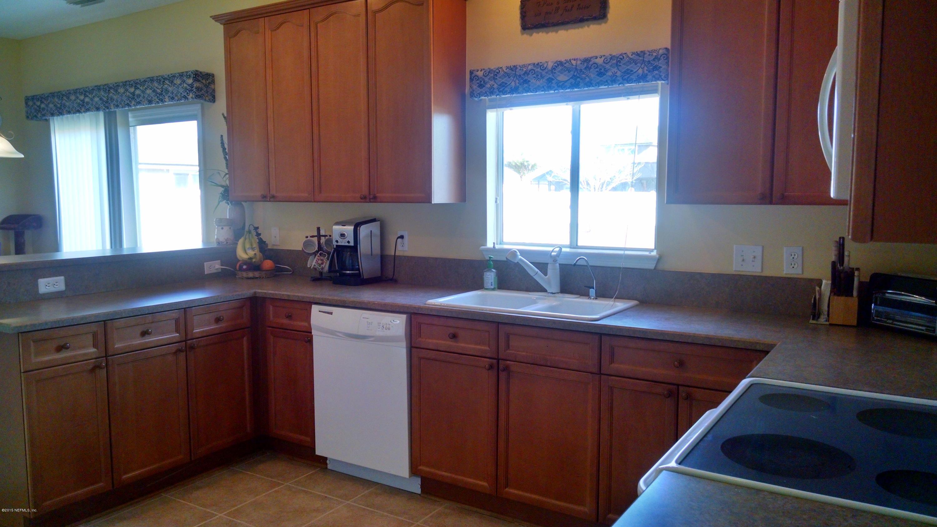 229 Porta Rosa Circle St. Augustine, FL 32092 - Photo 12 of 41 a kitchen with a sink cabinets and window