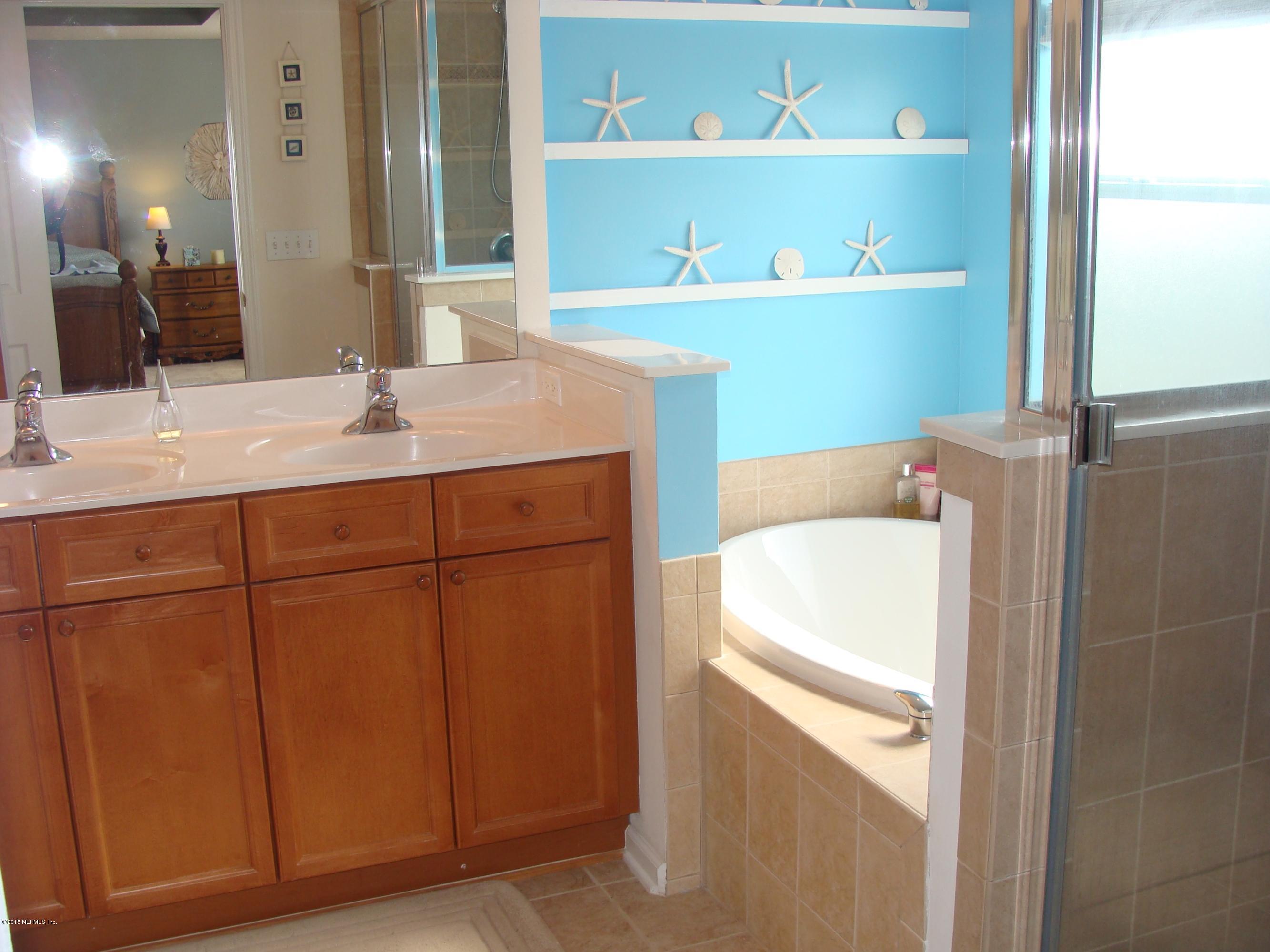 229 Porta Rosa Circle St. Augustine, FL 32092 - Photo 13 of 41 a bathroom with a sink and a mirror