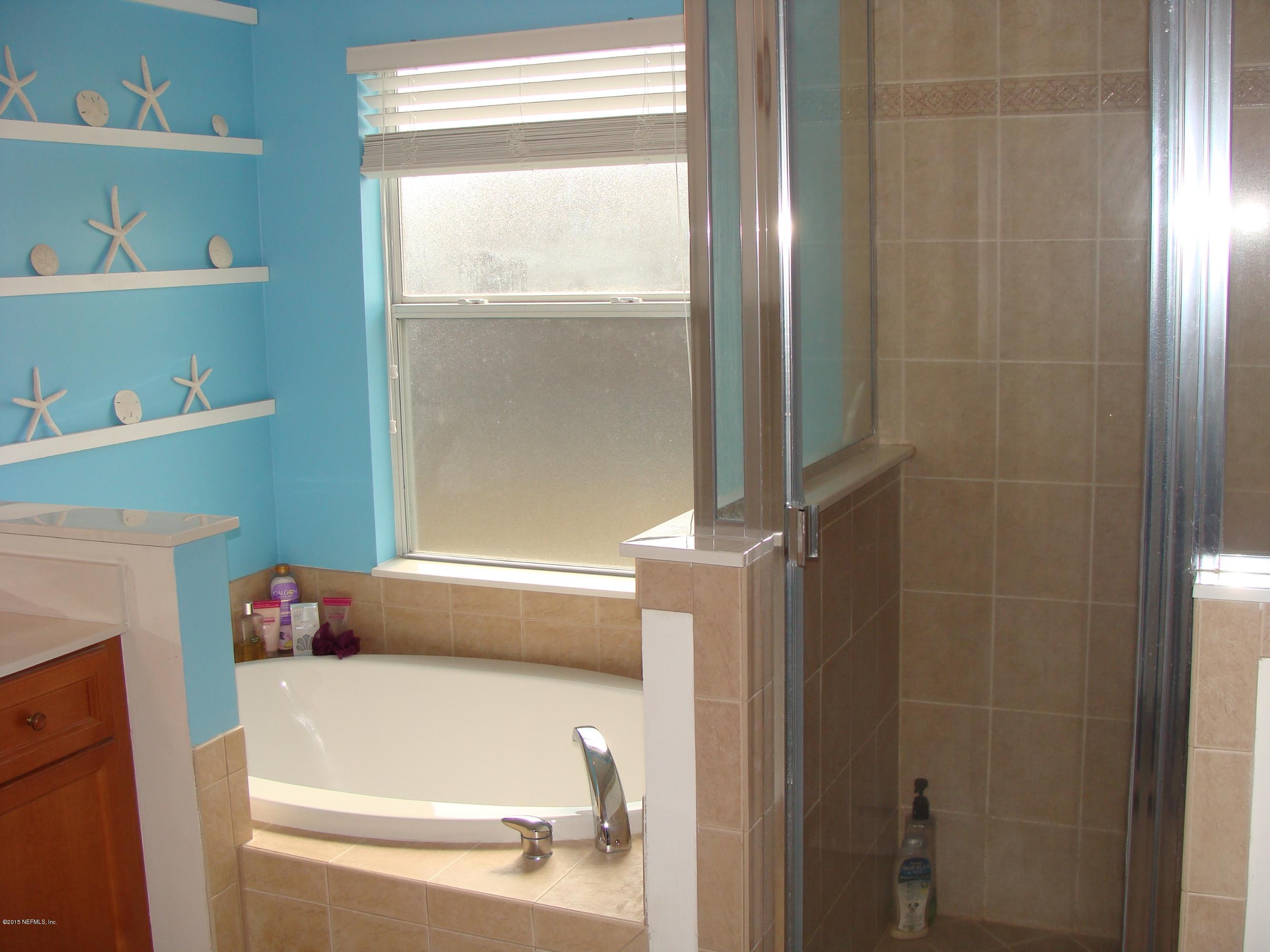 229 Porta Rosa Circle St. Augustine, FL 32092 - Photo 14 of 41 a bathroom with a tub and shower