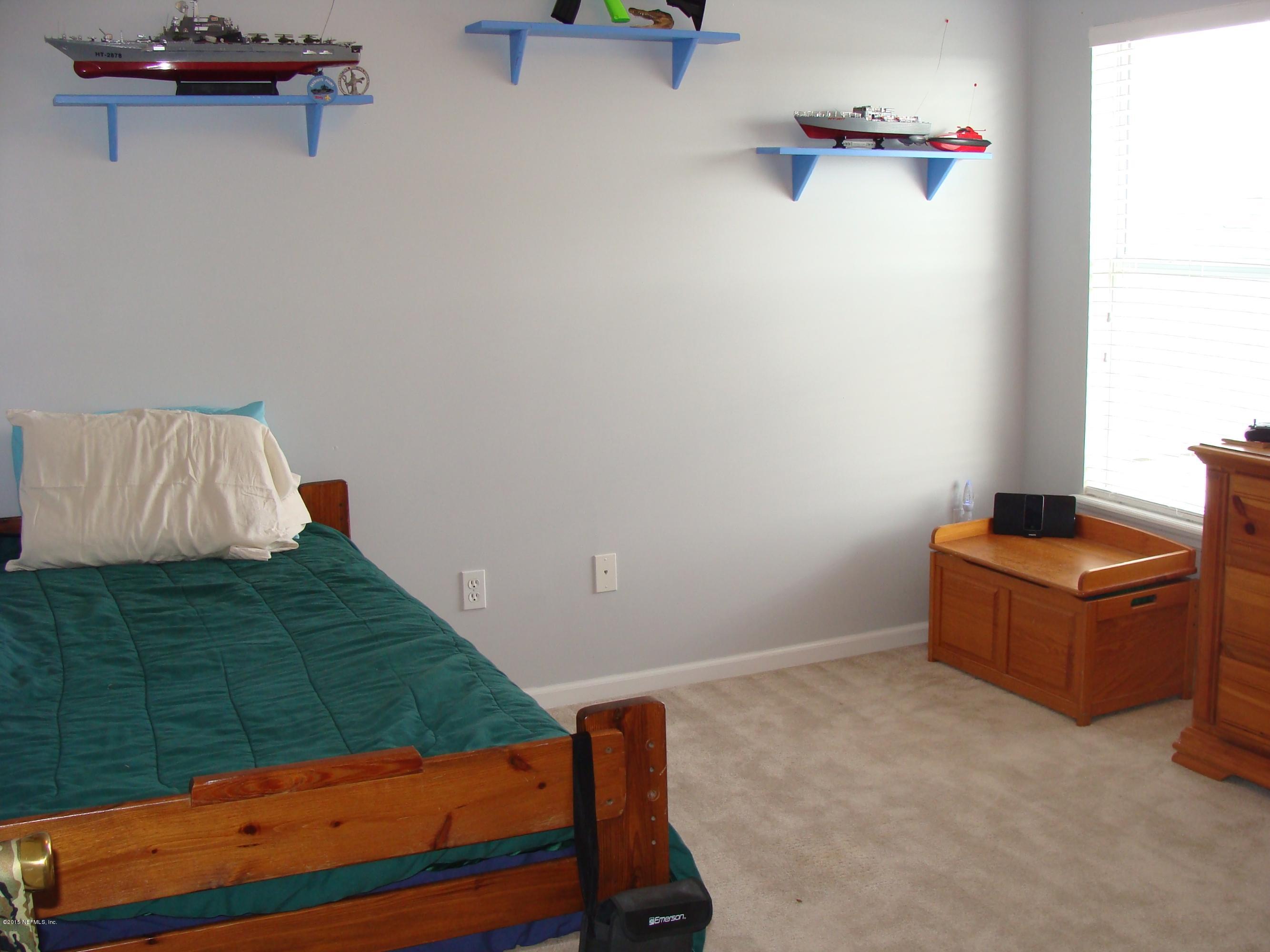229 Porta Rosa Circle St. Augustine, FL 32092 - Photo 16 of 41 a room with a bed and a table