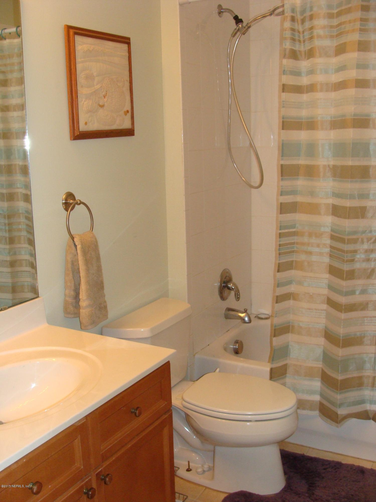 229 Porta Rosa Circle St. Augustine, FL 32092 - Photo 17 of 41 a bathroom with a sink a toilet and shower