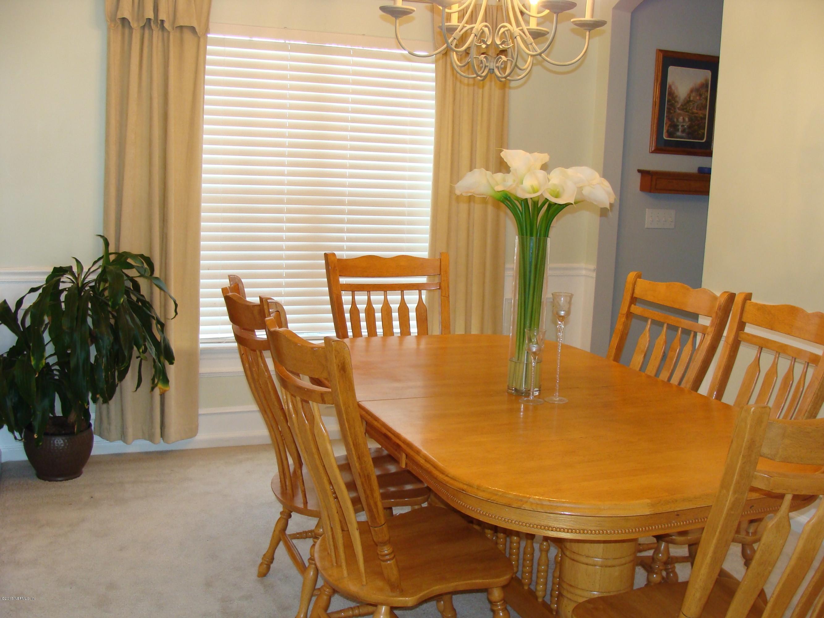 229 Porta Rosa Circle St. Augustine, FL 32092 - Photo 4 of 41 a view of a dining room with furniture and a window