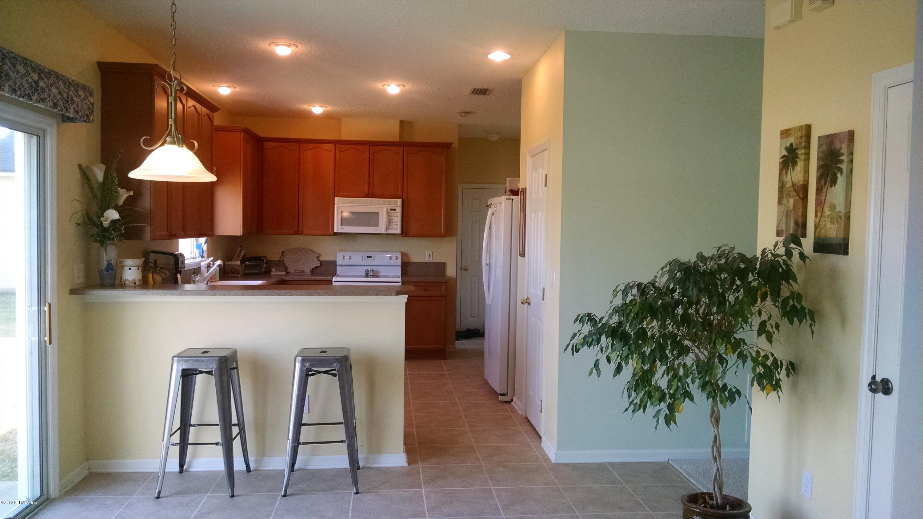 229 Porta Rosa Circle St. Augustine, FL 32092 - Photo 6 of 41 a kitchen with sink and refrigerator