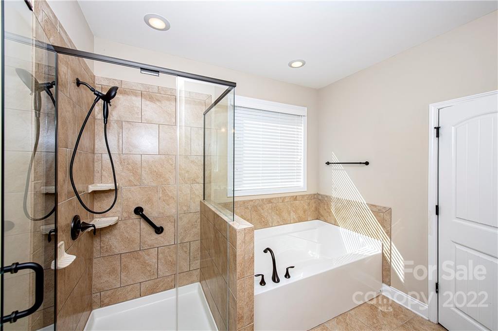 79145 Ridgehaven Road Lancaster, SC 29720 - Photo 17 of 46 a bathroom with a tub a toilet and a shower
