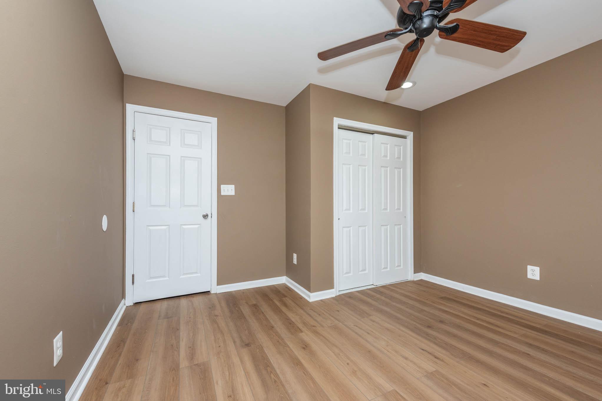 4021 Barrington Road Baltimore, MD 21207 - Photo 23 of 50 wooden floor in an empty room with a window
