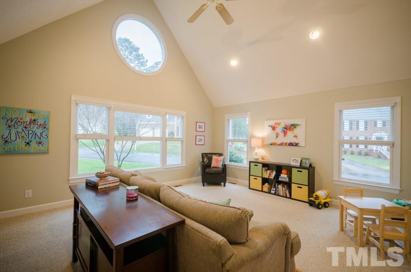 8321 Apple Orchard Way Raleigh, NC 27615 - Photo 11 of 24 a living room with furniture and a large window