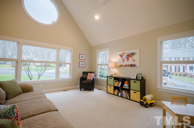 8321 Apple Orchard Way Raleigh, NC 27615 - Photo 13 of 24 a living room with furniture and a large window