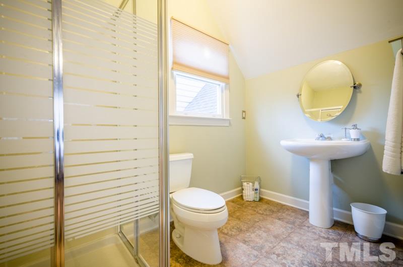 8321 Apple Orchard Way Raleigh, NC 27615 - Photo 20 of 24 a bathroom with a sink toilet and a mirror