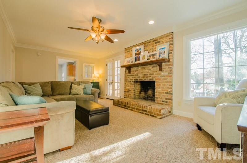 8321 Apple Orchard Way Raleigh, NC 27615 - Photo 3 of 24 a living room with furniture and a fireplace