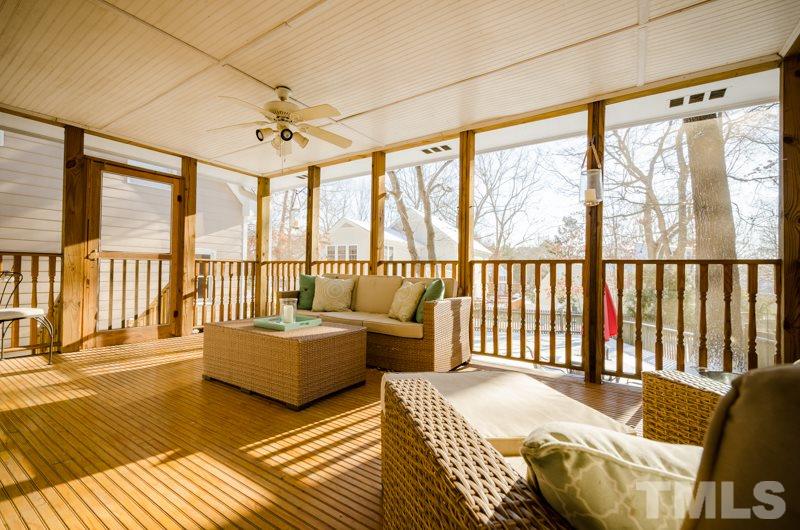 8321 Apple Orchard Way Raleigh, NC 27615 - Photo 22 of 24 a living room with furniture and a floor to ceiling window