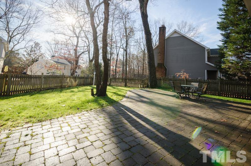 8321 Apple Orchard Way Raleigh, NC 27615 - Photo 24 of 24 a view of backyard with a table and chair