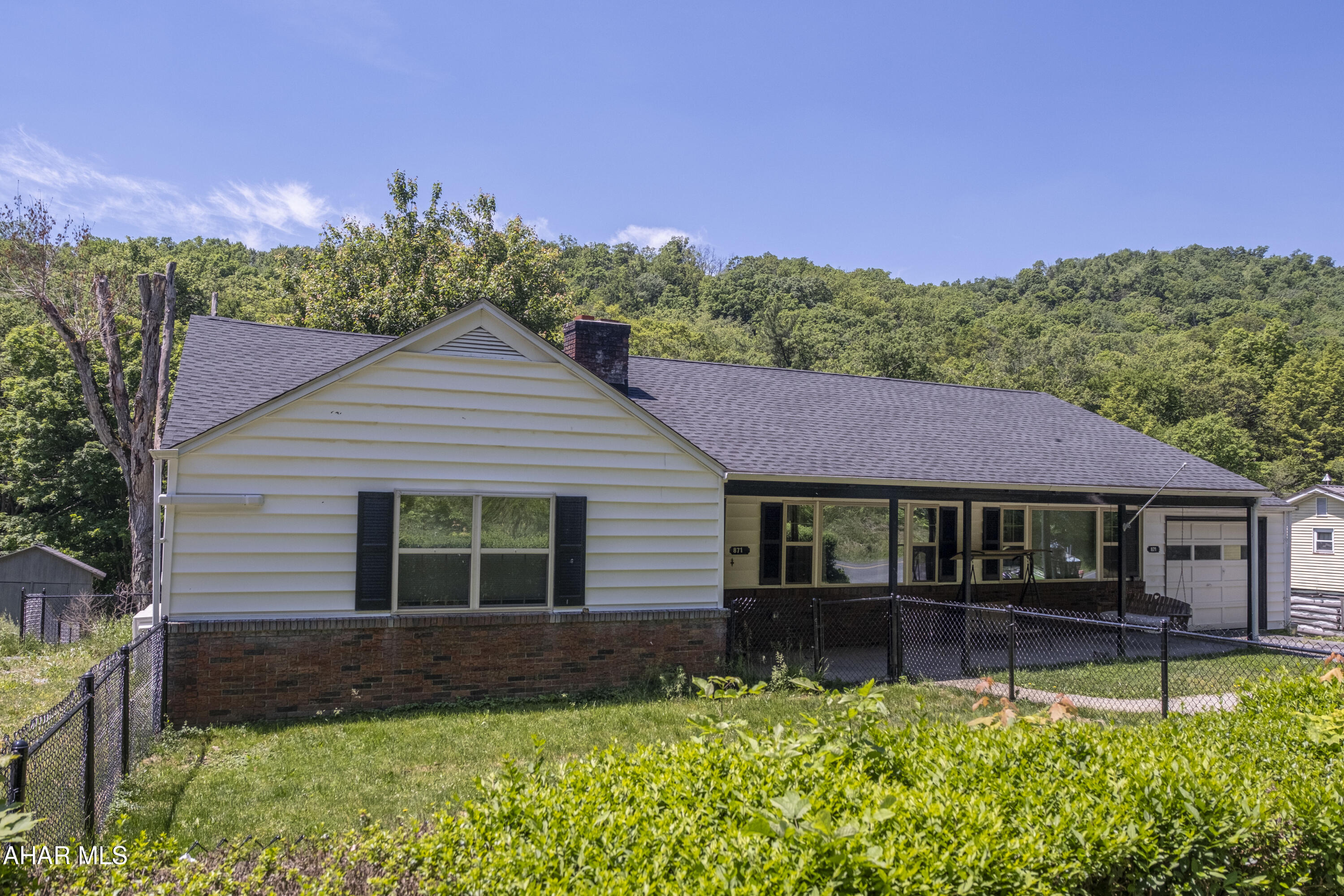 871 Decker Hollow Road Tyrone, PA 16686 - Photo 8 of 35 a house that has a lot of plants in it