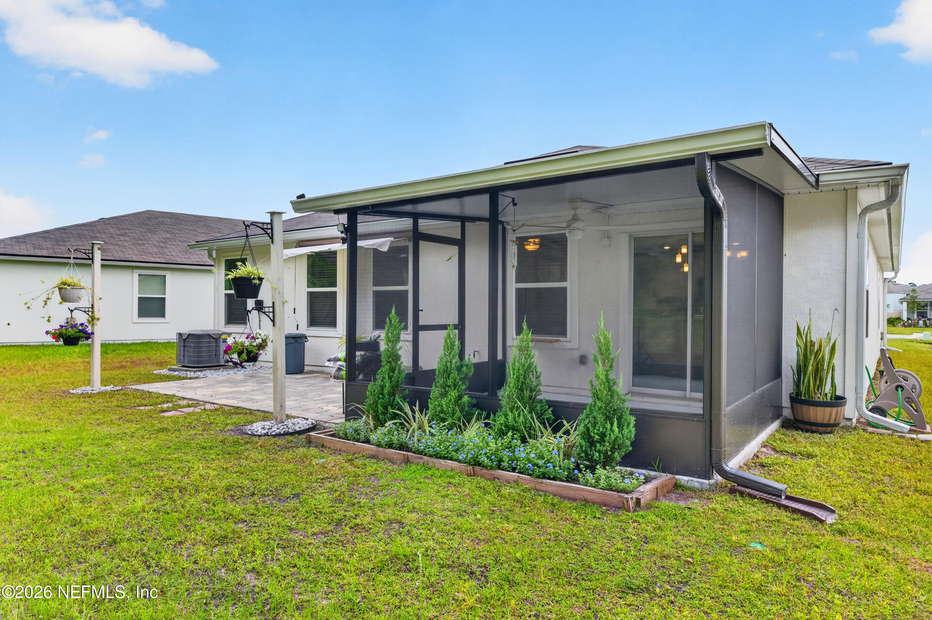 231 Encanto Way Street St. Augustine, FL 32084 - Photo 21 of 36 a view of a house with a patio