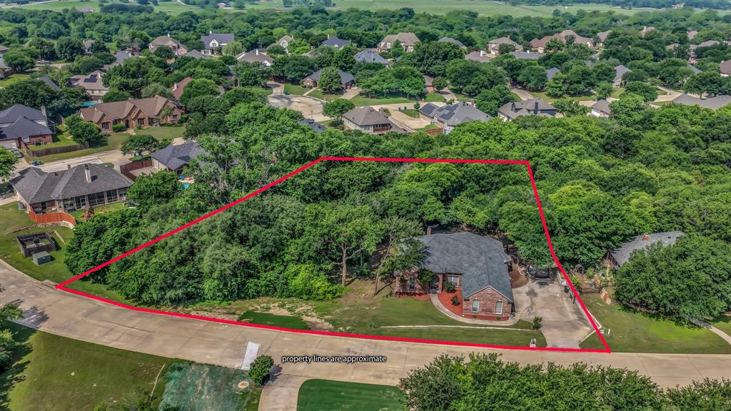 203 Mockingbird Lane Aledo, TX 76008 - Photo 37 of 37 Expansive residential lot featuring mature tree coverage and a curved street frontage