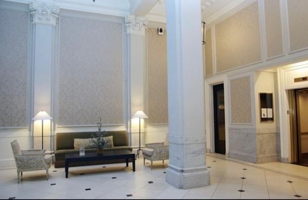 21 Beacon Street, Unit 5D Boston, MA 02108 - Photo 11 of 11 a living room with furniture