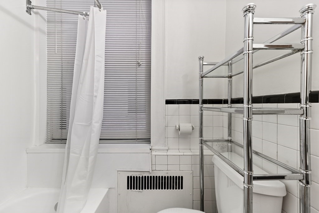 21 Beacon Street, Unit 5D Boston, MA 02108 - Photo 7 of 11 a bathroom with a shower