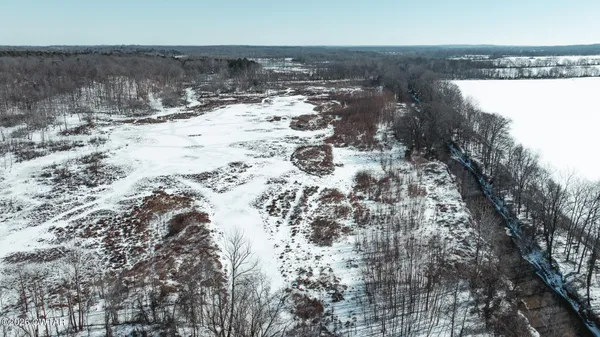 a view of a dry yard with a snow
