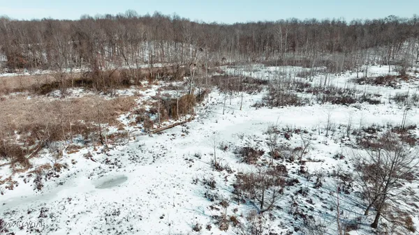 a roof deck with table and chairs