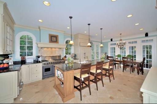 411 South County Line Road Hinsdale, IL 60521 - Photo 6 of 16 a large kitchen with lots of furniture and appliances