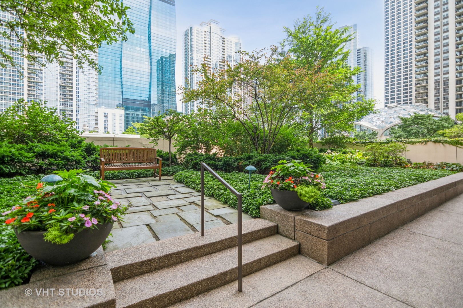 360 East Randolph Street, Unit 308 Chicago, IL 60601 - Photo 20 of 24 a view of a garden with plants and large trees