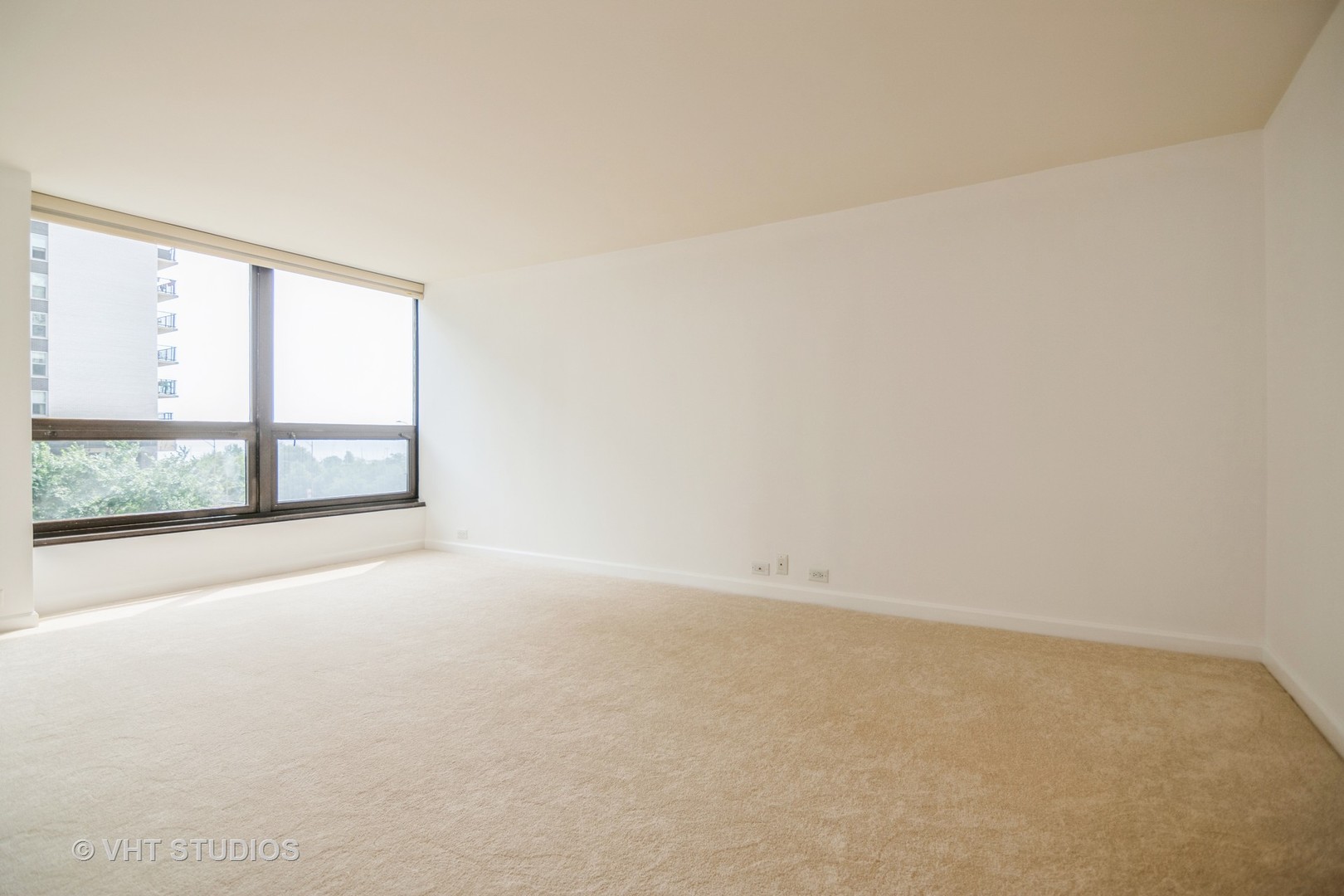 360 East Randolph Street, Unit 308 Chicago, IL 60601 - Photo 8 of 24 an empty room with a window
