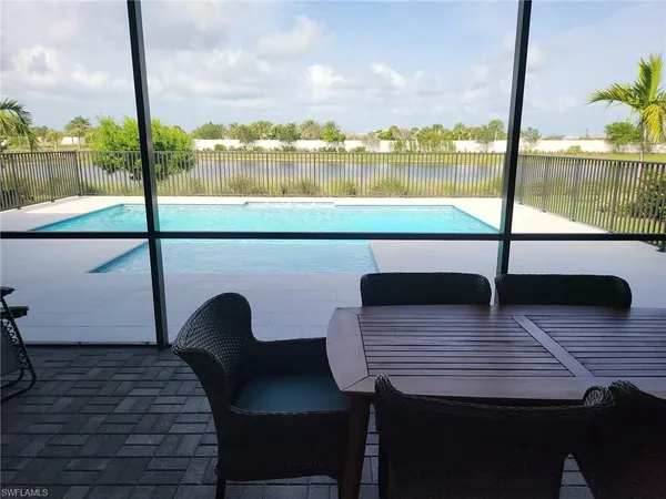 a swimming pool with lake view