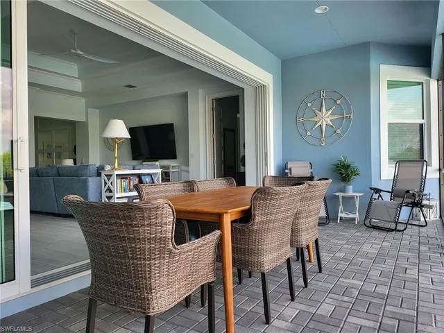 a living room with stainless steel appliances kitchen island granite countertop furniture and a view of kitchen