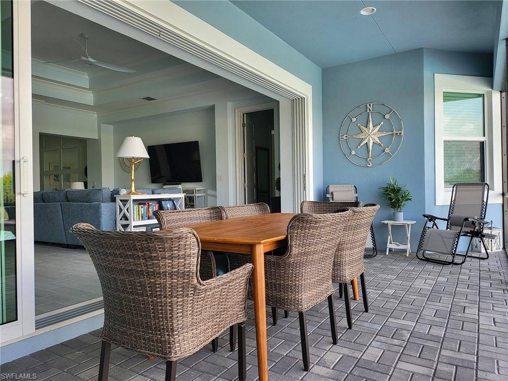 8770 Calypso Court Naples, FL 34113 - Photo 18 of 47 a dining room with furniture and window