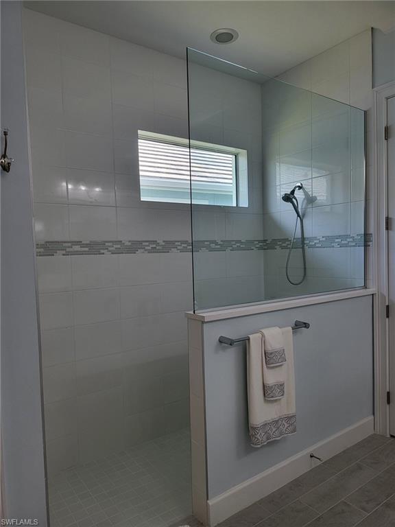 8770 Calypso Court Naples, FL 34113 - Photo 24 of 47 a bathroom with a shower