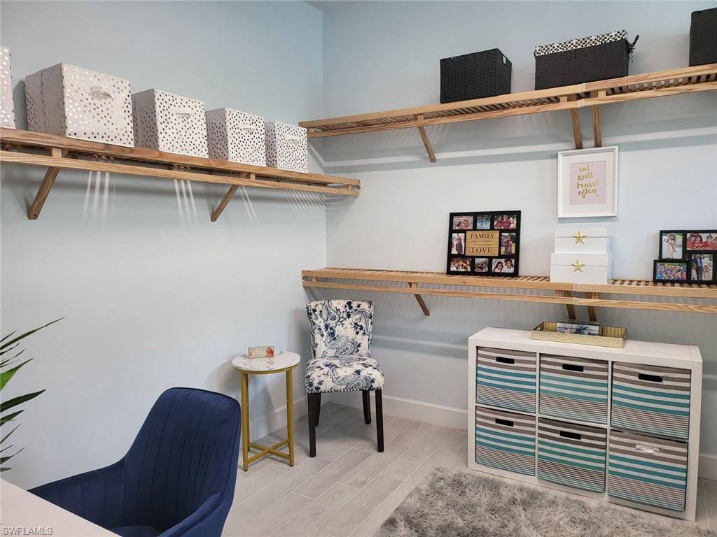 8770 Calypso Court Naples, FL 34113 - Photo 25 of 47 a bedroom with a bunk bed and a desk