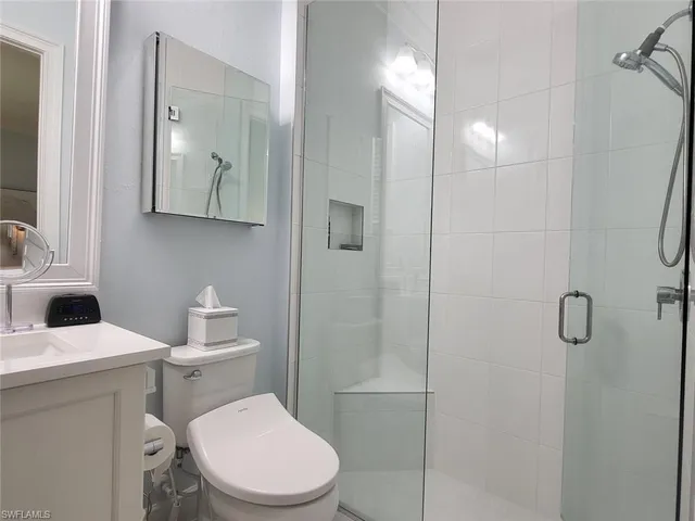 a bed room with a bed window and a television