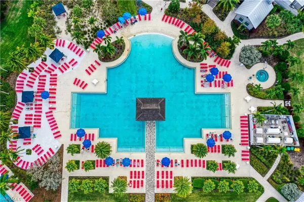 swimming pool with outdoor seating and yard