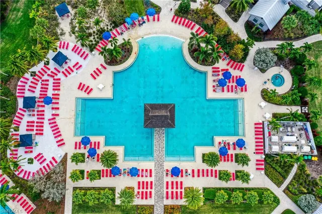 swimming pool with outdoor seating and yard
