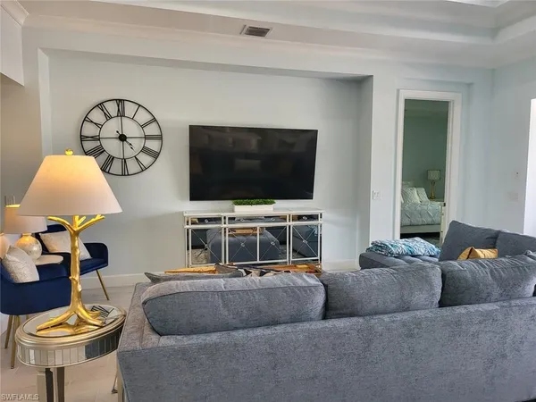 a kitchen with stainless steel appliances granite countertop a sink a stove and a wooden floors