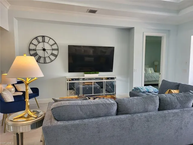 a kitchen with stainless steel appliances granite countertop a sink a stove and a wooden floors