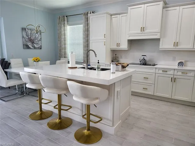 a wooden bench sitting on a table next to a lake