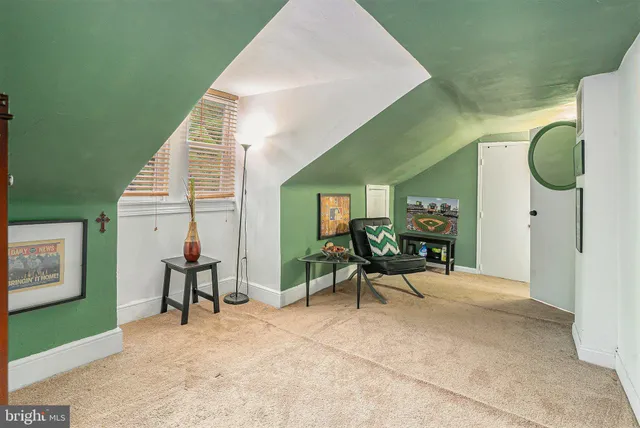 a living room with furniture and a chair