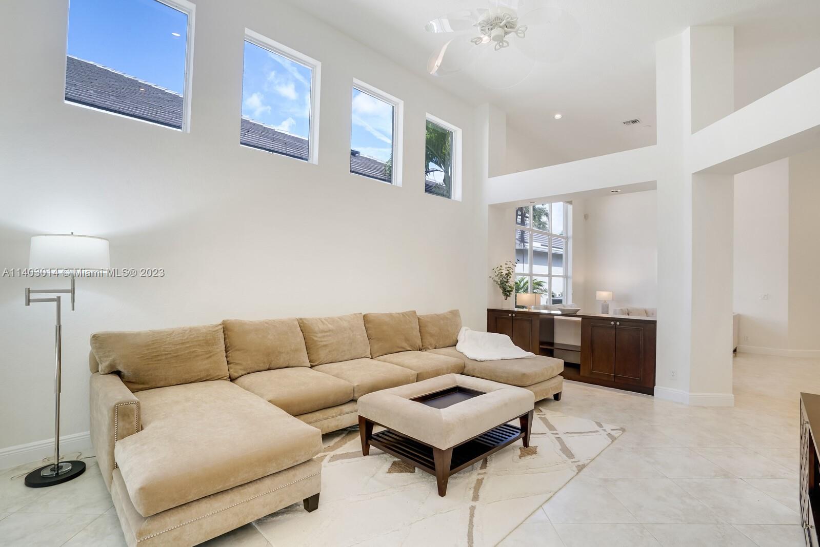 3322 Northwest 53rd Circle Boca Raton, FL 33496 - Photo 11 of 45 a living room with furniture and a couch